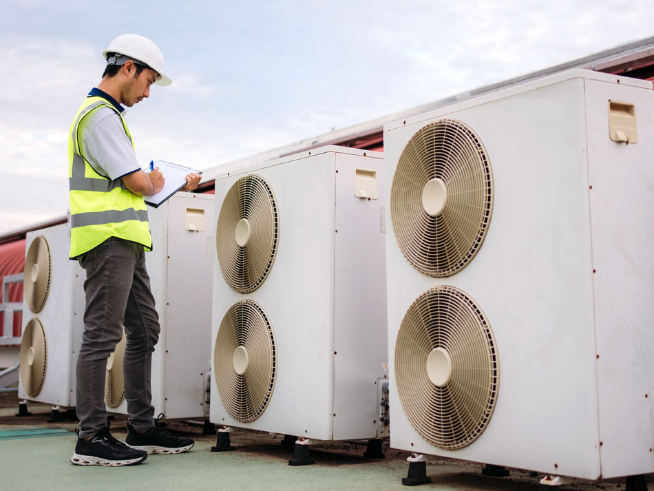 Commercial-Maintenance-73283347-950×712 Technician working on commercial HVAC units